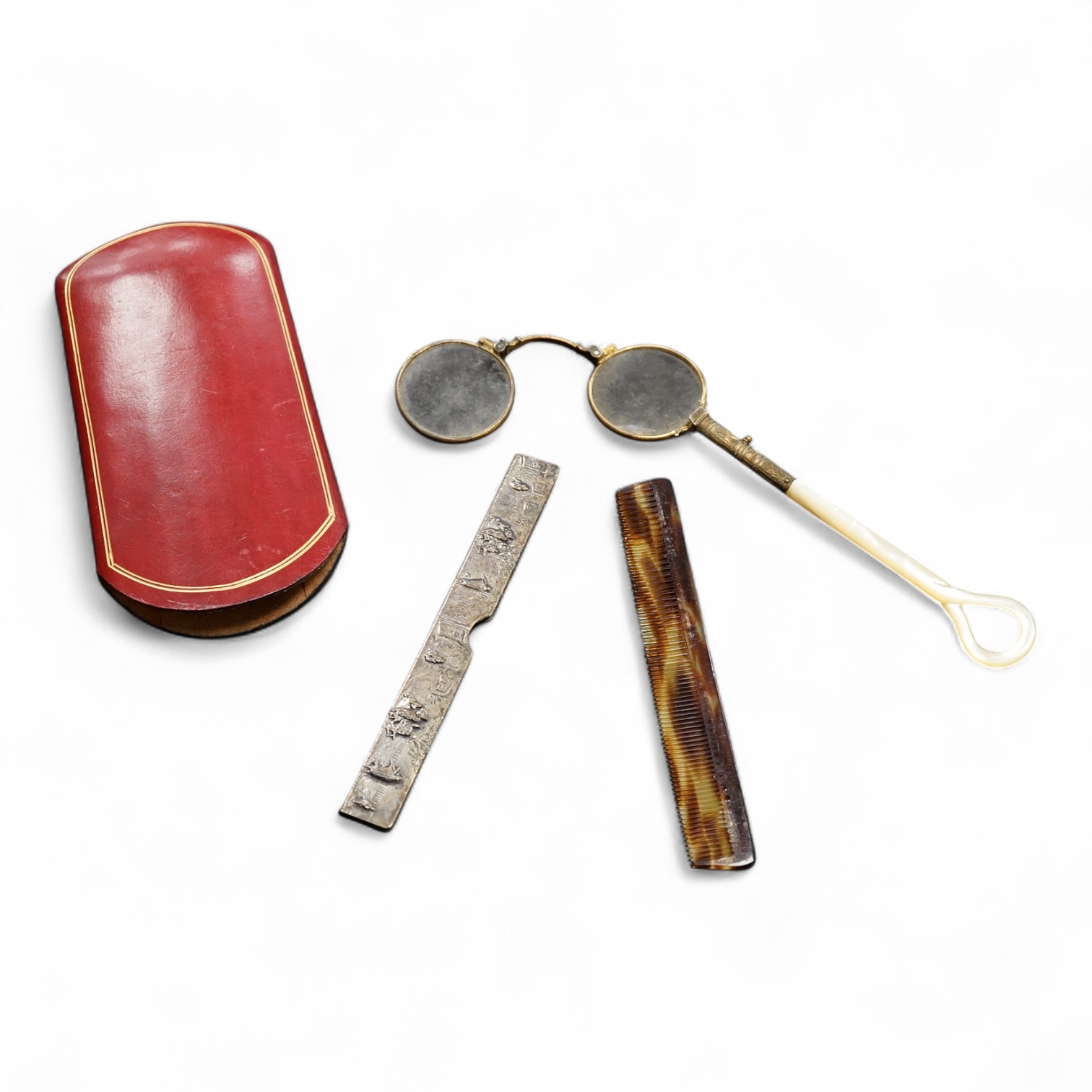 A pair of mother of pearl handled gilt metal lorgnettes in a leather case and a comb housed in an antimony case, largest 16cm in length